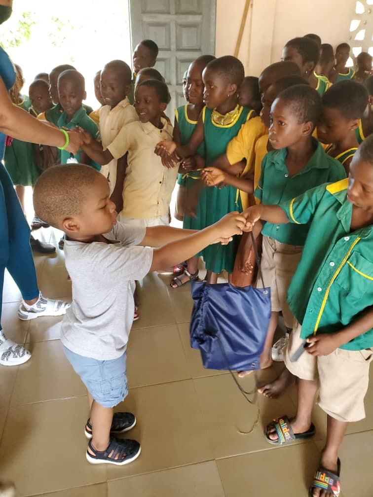 Children receiving school supplies
