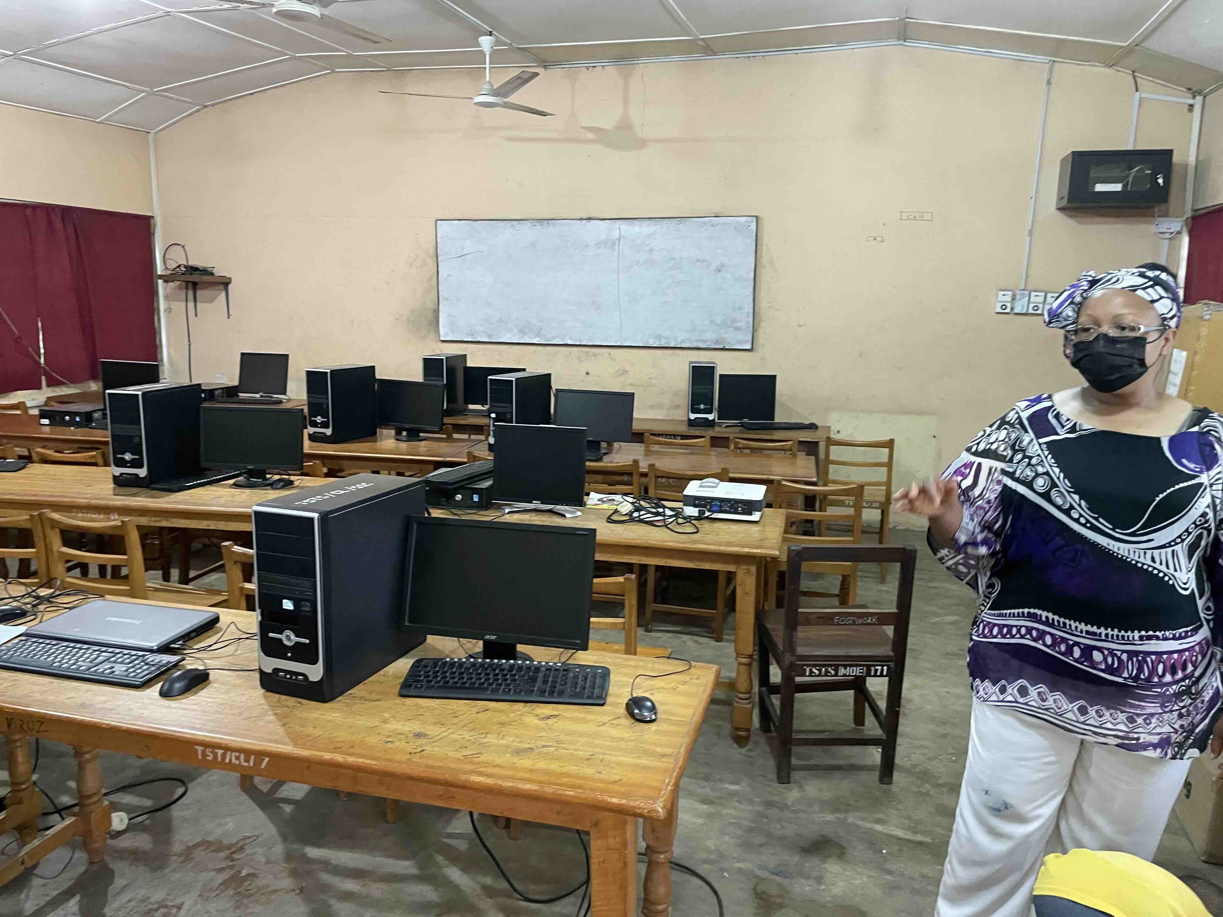 Students crowding around limited working computers